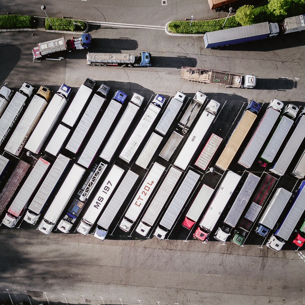 Bird's eye view of trucks on a crowded rest area 