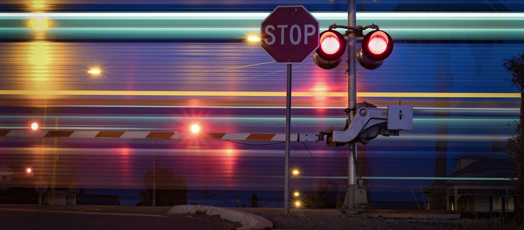 Railroad crossing with a passing train